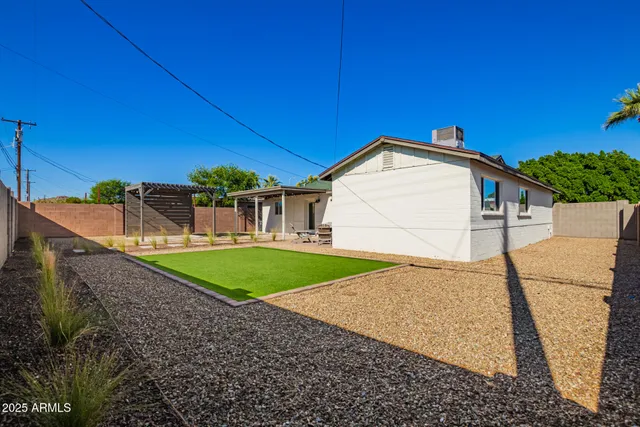 a view of a backyard of a house