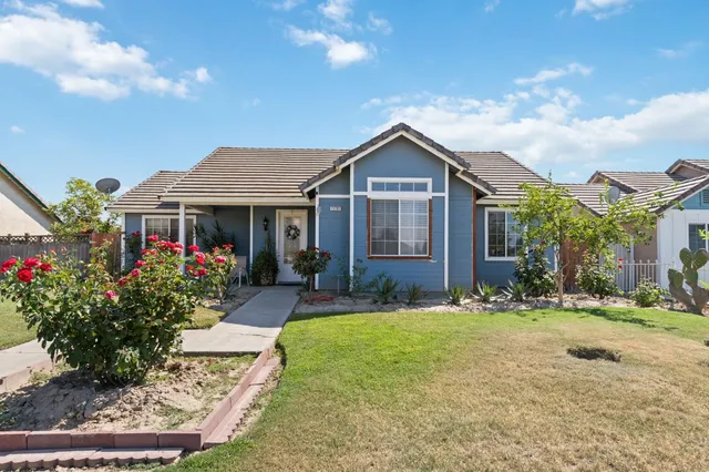front view of a house with a yard