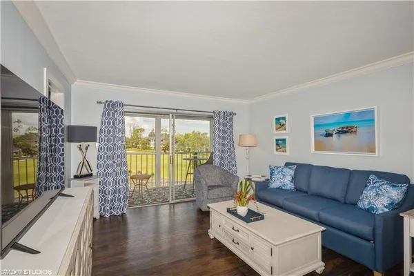 a living room with furniture and a flat screen tv