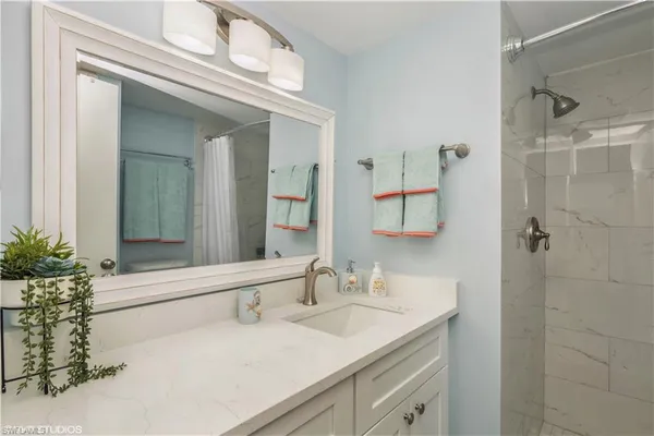 a bathroom with a sink and a mirror