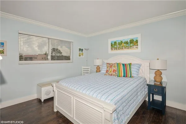 a bedroom with a bed and a table