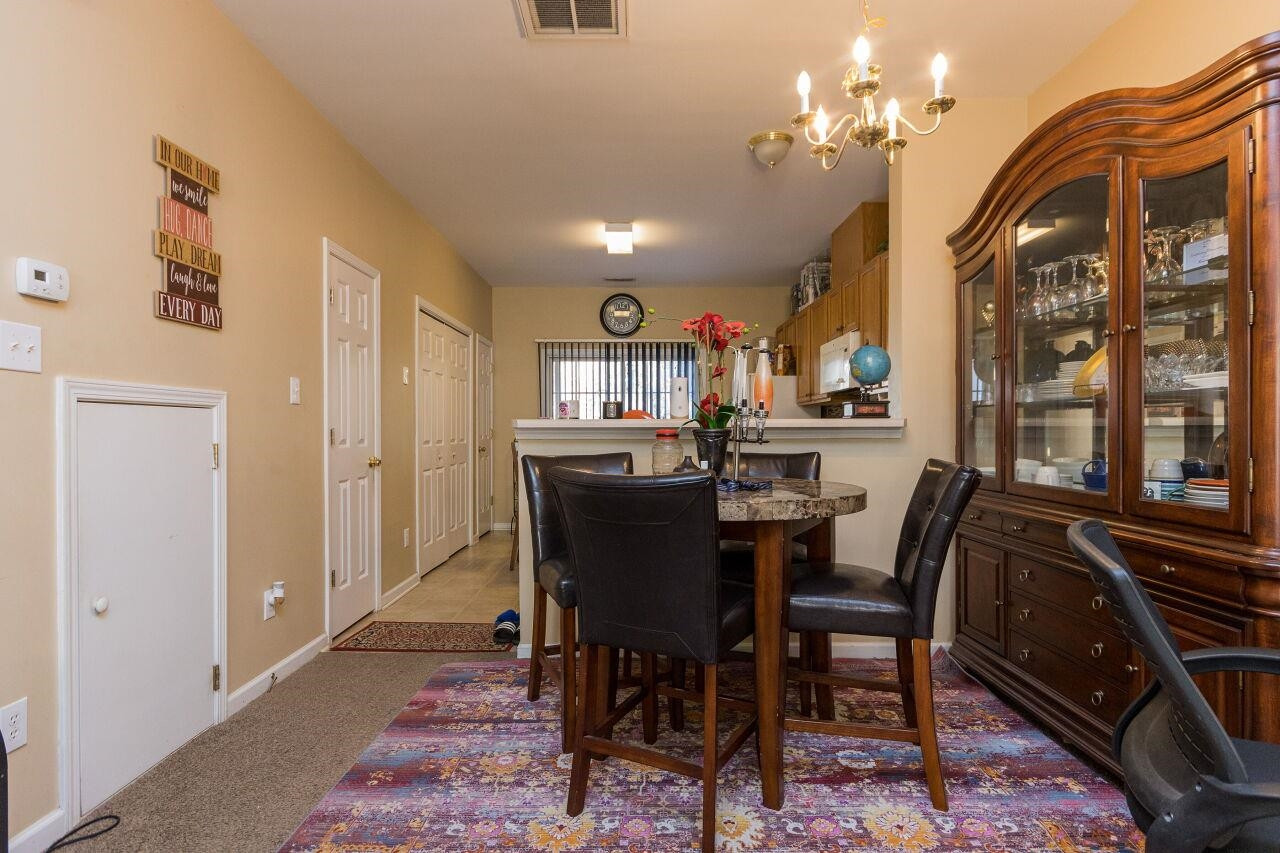 4802 Parkville Drive Raleigh, NC 27604 - Photo 7 of 15 a view of a dining room with furniture