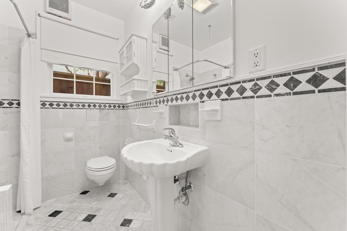 2534 Harris Boulevard Austin, TX 78703 - Photo 14 of 26 a bathroom with a sink a toilet and shower