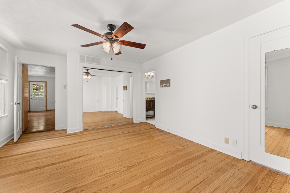 2534 Harris Boulevard Austin, TX 78703 - Photo 17 of 26 a bedroom with a bed and wooden floor