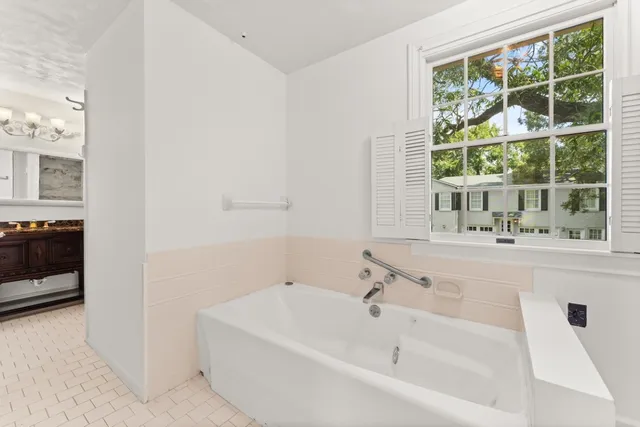 a view of kitchen with granite countertop cabinets and wooden floor