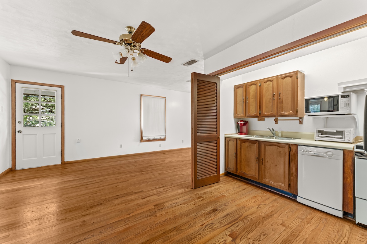 2534 Harris Boulevard Austin, TX 78703 - Photo 20 of 26 a view of kitchen with granite countertop cabinets and wooden floor