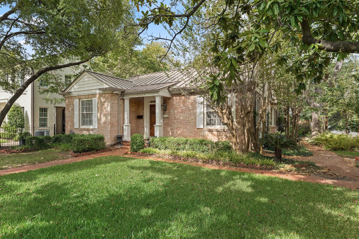 2534 Harris Boulevard Austin, TX 78703 - Photo 2 of 26 a front view of a house with a garden and yard