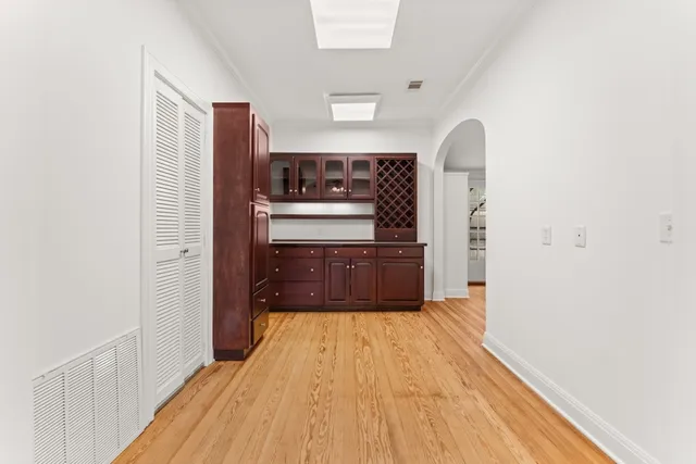 a kitchen with stainless steel appliances a refrigerator and a stove top oven