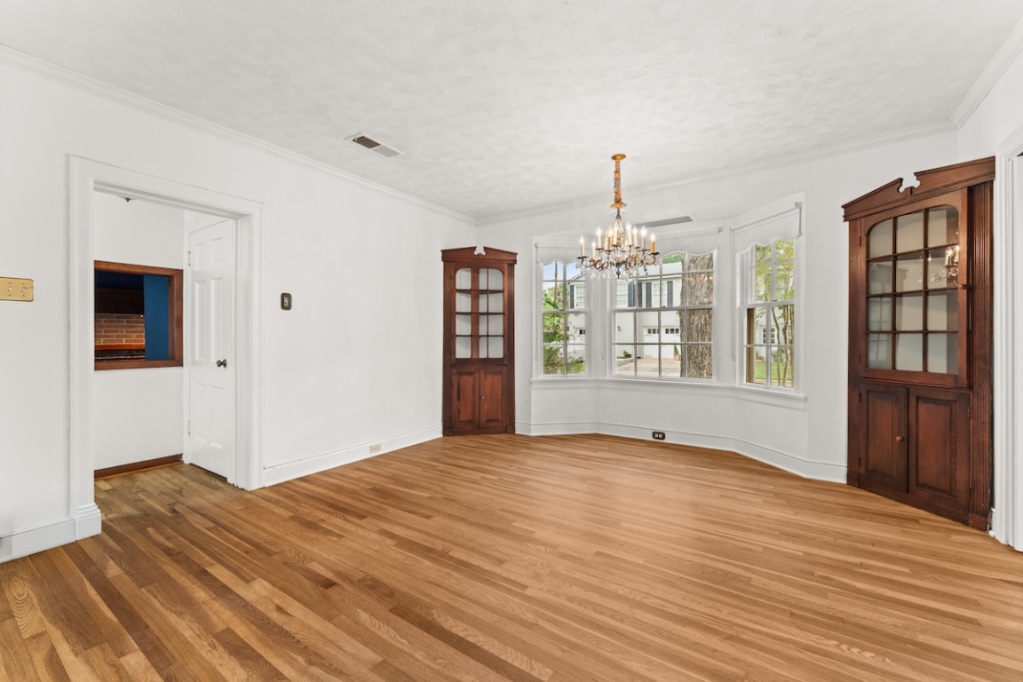 2534 Harris Boulevard Austin, TX 78703 - Photo 9 of 26 a view of an empty room with window and wooden floor