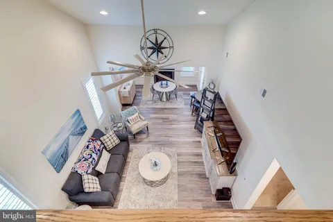 a view of a living room with wooden floor