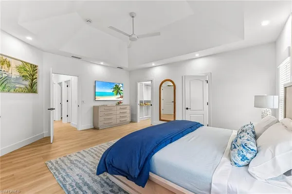 a bedroom with a large bed and a window