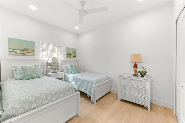 a bedroom with a bed and a cabinets