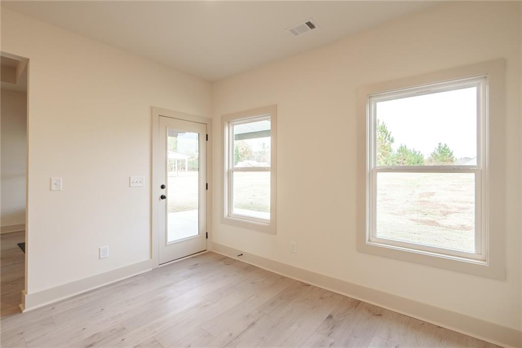 205 Squirrel Run Good Hope, GA 30641 - Photo 12 of 50 an empty room with windows