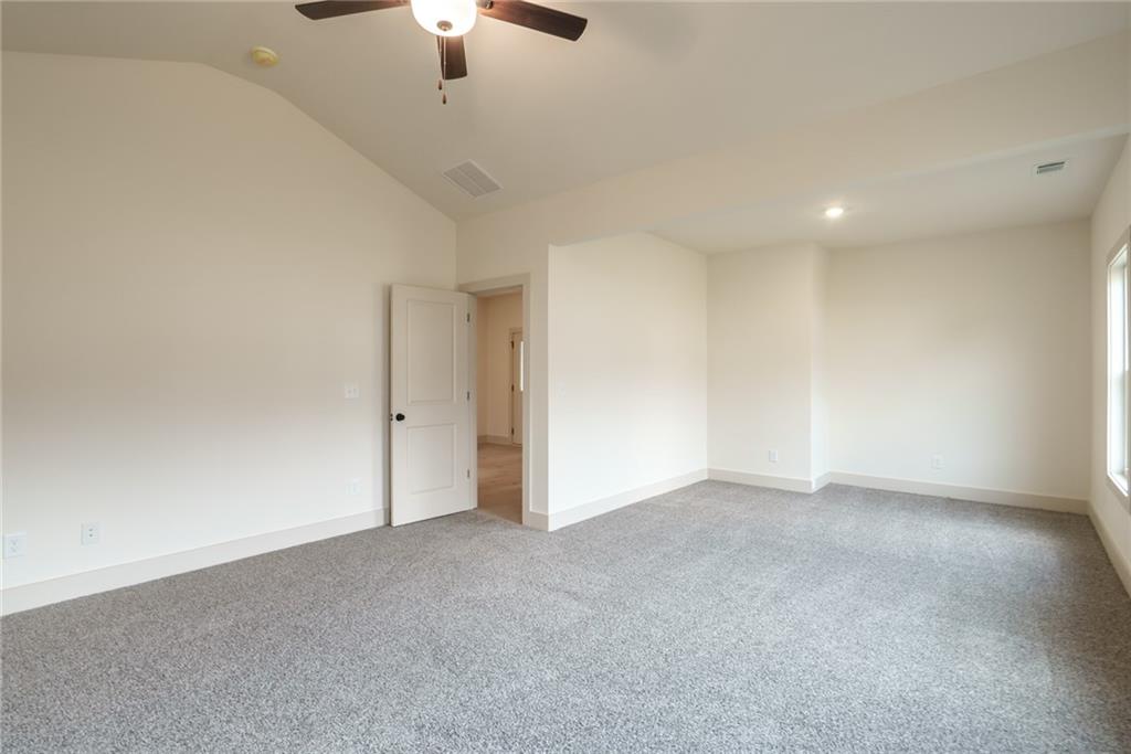 205 Squirrel Run Good Hope, GA 30641 - Photo 18 of 50 a view of an empty room with a chandelier fan