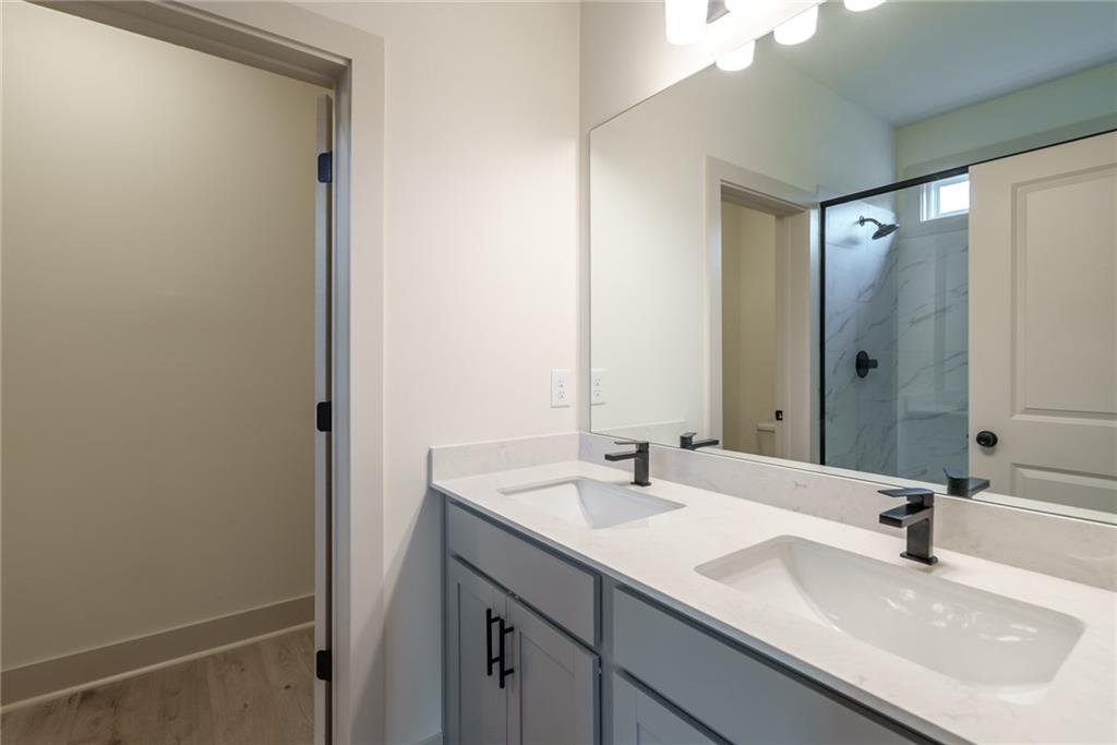 205 Squirrel Run Good Hope, GA 30641 - Photo 19 of 50 a bathroom with a sink and a mirror