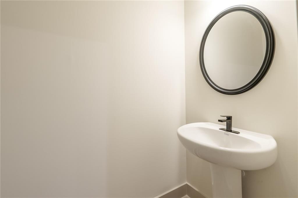 205 Squirrel Run Good Hope, GA 30641 - Photo 22 of 50 a bathroom with a sink and a mirror