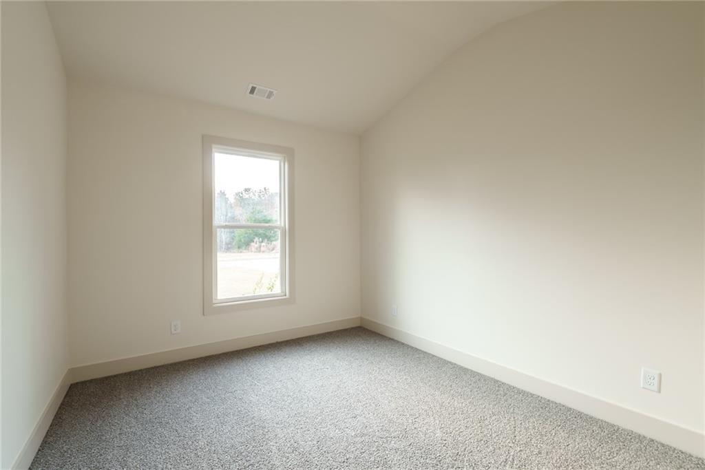 205 Squirrel Run Good Hope, GA 30641 - Photo 24 of 50 an empty room with a window