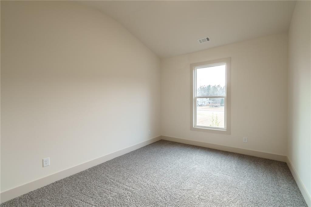 205 Squirrel Run Good Hope, GA 30641 - Photo 26 of 50 an empty room with a window