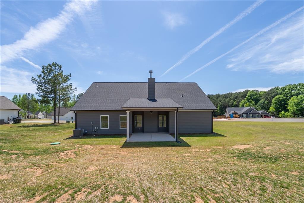 205 Squirrel Run Good Hope, GA 30641 - Photo 34 of 50 a front view of a house with a garden