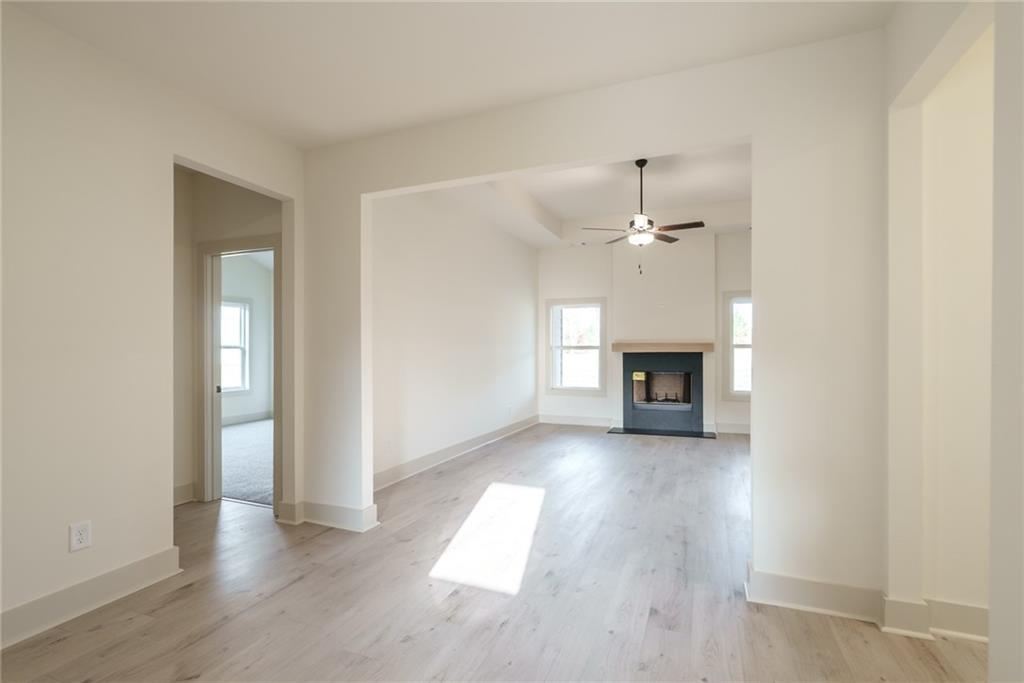 205 Squirrel Run Good Hope, GA 30641 - Photo 5 of 50 an empty room with large windows and a fireplace
