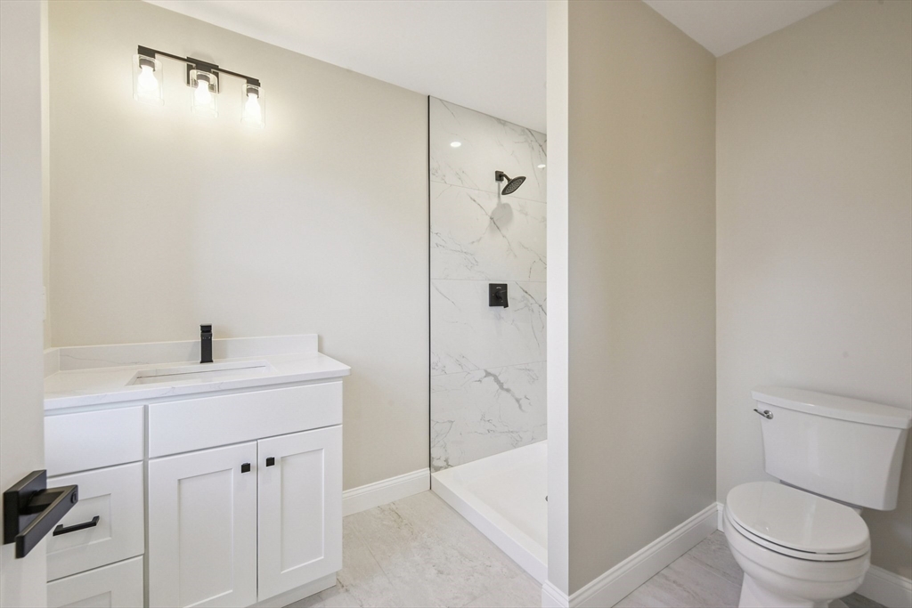 120 Stowe Street, Unit 120 Fall River, MA 02720 - Photo 15 of 21 a bathroom with a sink a toilet and shower