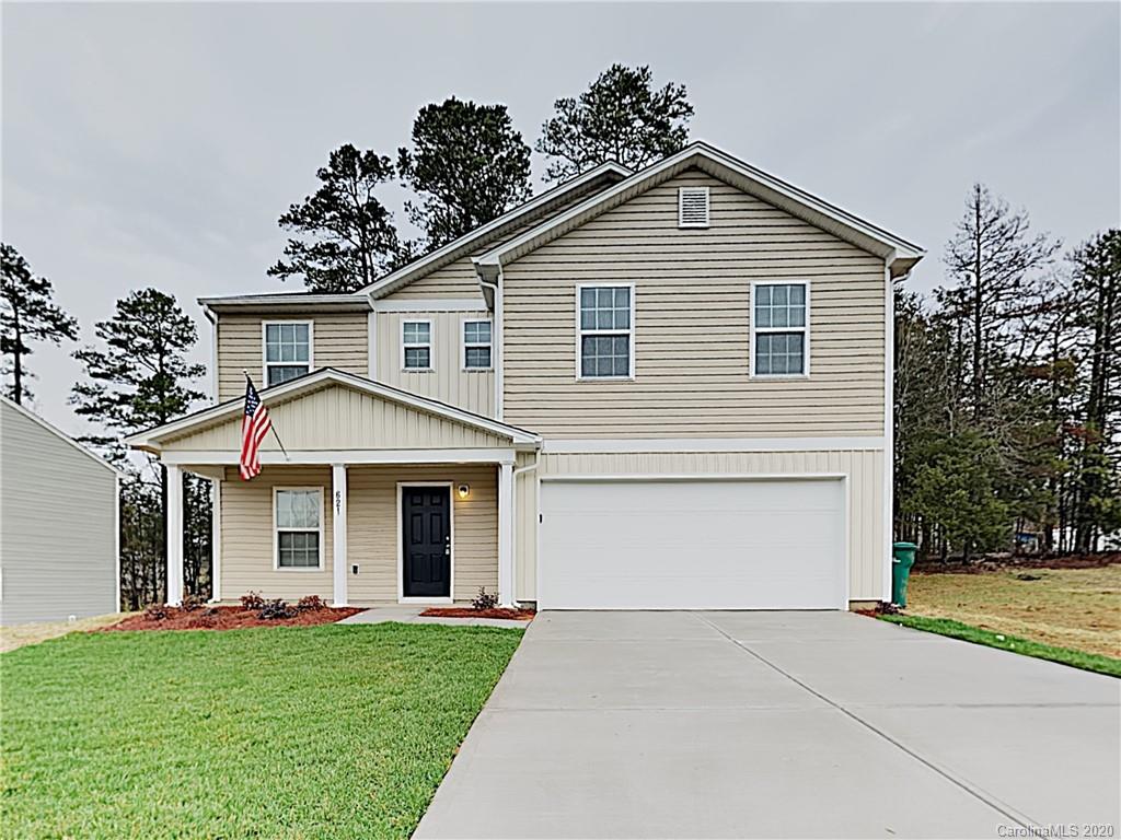 621 Buckskin Road Oakboro, NC 28129 - Photo 1 of 15 a front view of a house with a yard