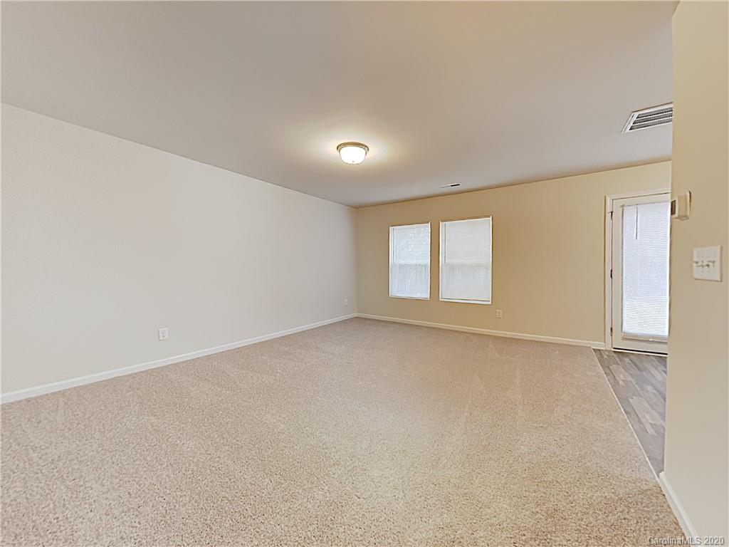 621 Buckskin Road Oakboro, NC 28129 - Photo 2 of 15 a view of an empty room with a window