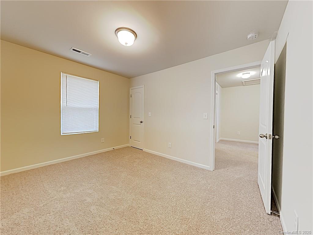 621 Buckskin Road Oakboro, NC 28129 - Photo 12 of 15 an empty room with windows and closet