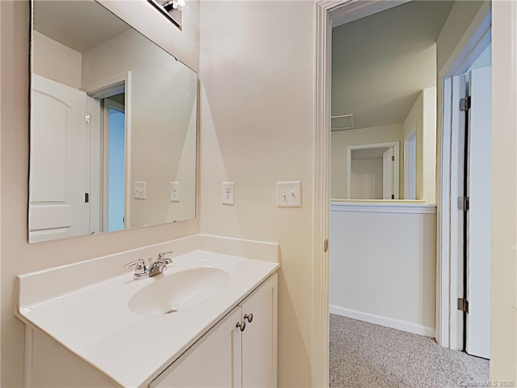 621 Buckskin Road Oakboro, NC 28129 - Photo 14 of 15 a bathroom with a sink and a mirror