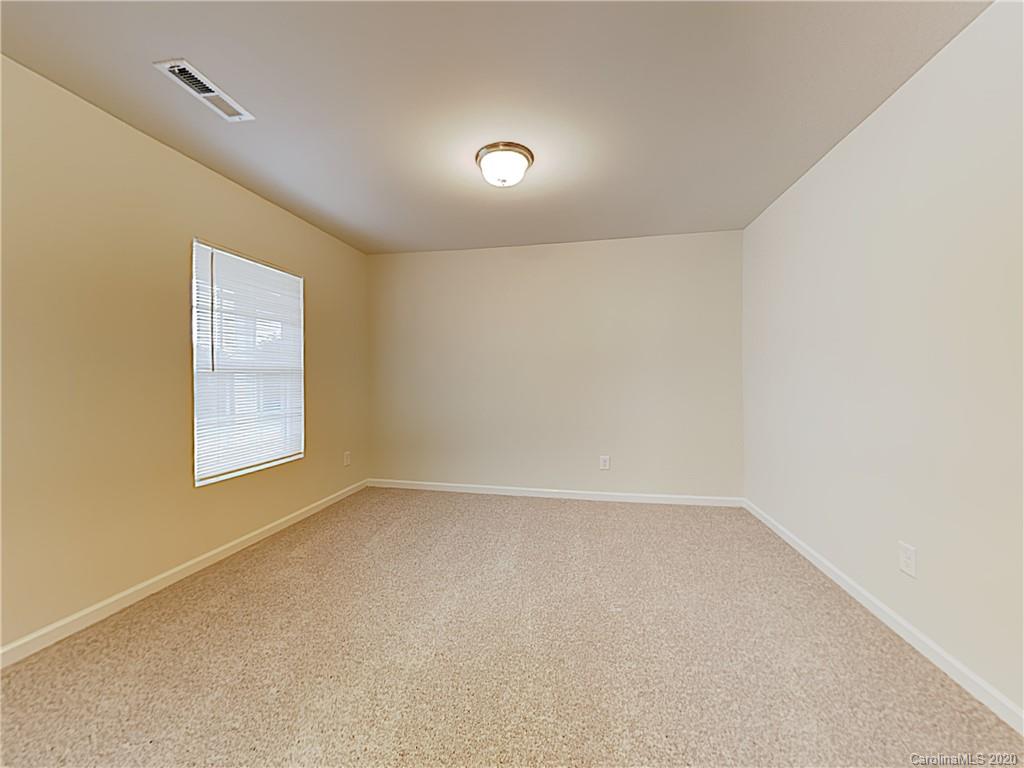 621 Buckskin Road Oakboro, NC 28129 - Photo 5 of 15 an empty room with a window