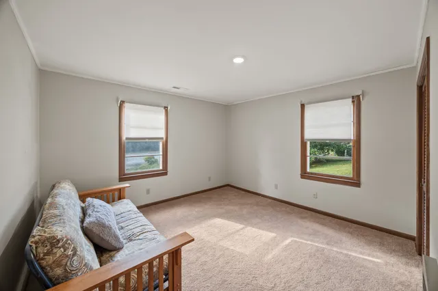 a bedroom with furniture and window