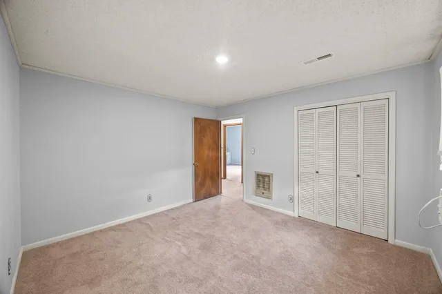 a living room with furniture and white walls