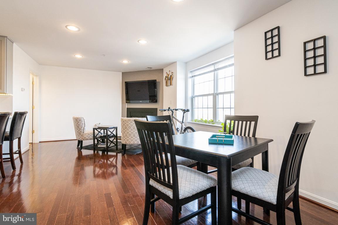 4800 Coyle Road, Unit 506 Owings Mills, MD 21117 - Photo 19 of 24 Kitchen Table/Family Room Combo w/ Gas Fireplace