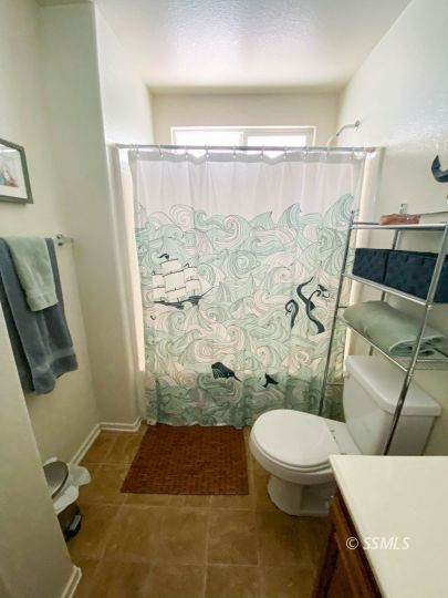 1109 Rebecca Avenue Ridgecrest, CA 93555 - Photo 46 of 50 a bathroom with a toilet and shower