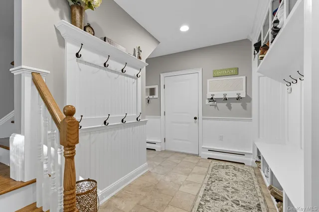 a bathroom with a tub sink and mirror
