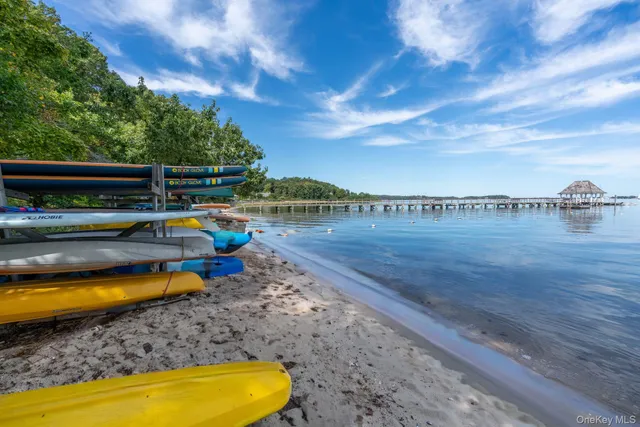 a view of a swimming pool with an outdoor seating and yard