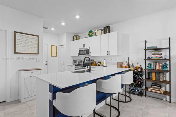 a view of kitchen island with furniture and wooden floor