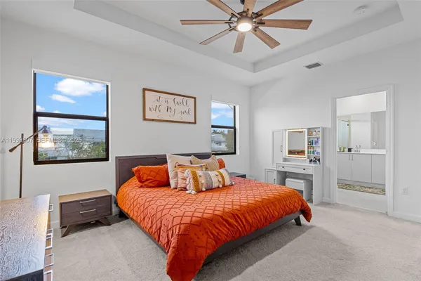 a bedroom with a bed and dresser