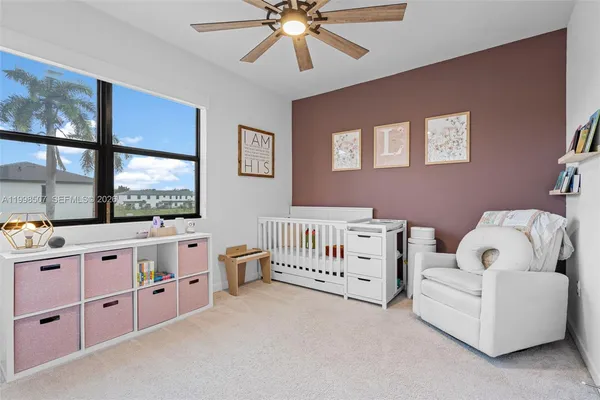 a bedroom with furniture and windows