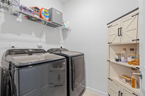 a utility room with cabinets