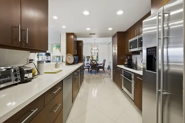 a kitchen with counter top space cabinets and stainless steel appliances