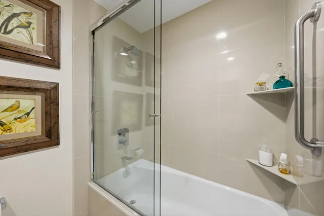 a bathroom with a tub and a sink