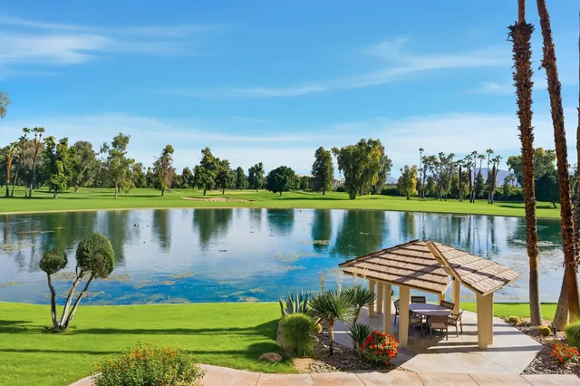 a view of a lake with a lake in front of the house