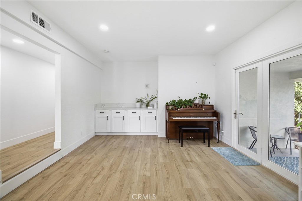 384 Colorado Street Arcadia, CA 91007 - Photo 30 of 51 a view of a room with wooden floor and furniture