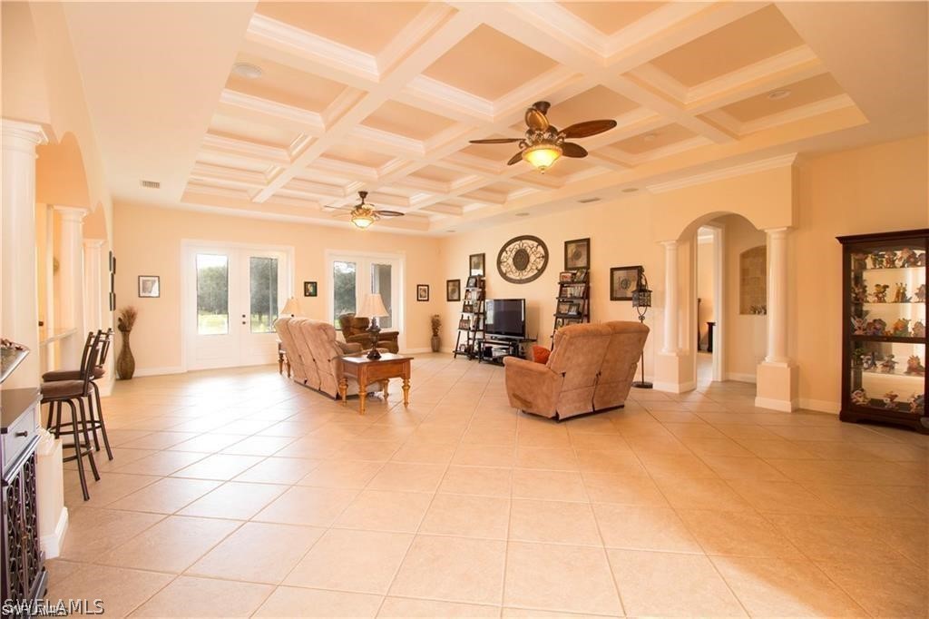 2750 Styles Road Alva, FL 33920 - Photo 4 of 8 a living room with furniture and a flat screen tv