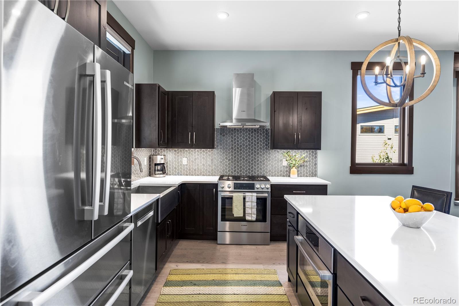 143 Beasley Road Silverthorne, CO 80498 - Photo 12 of 40 a kitchen with stainless steel appliances granite countertop a sink a stove and a refrigerator