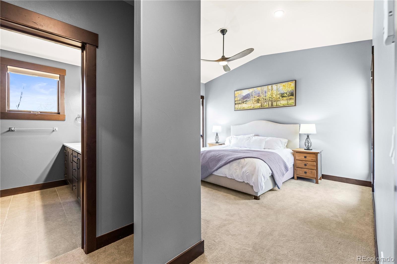 143 Beasley Road Silverthorne, CO 80498 - Photo 15 of 40 a bedroom with a bed and a night stand