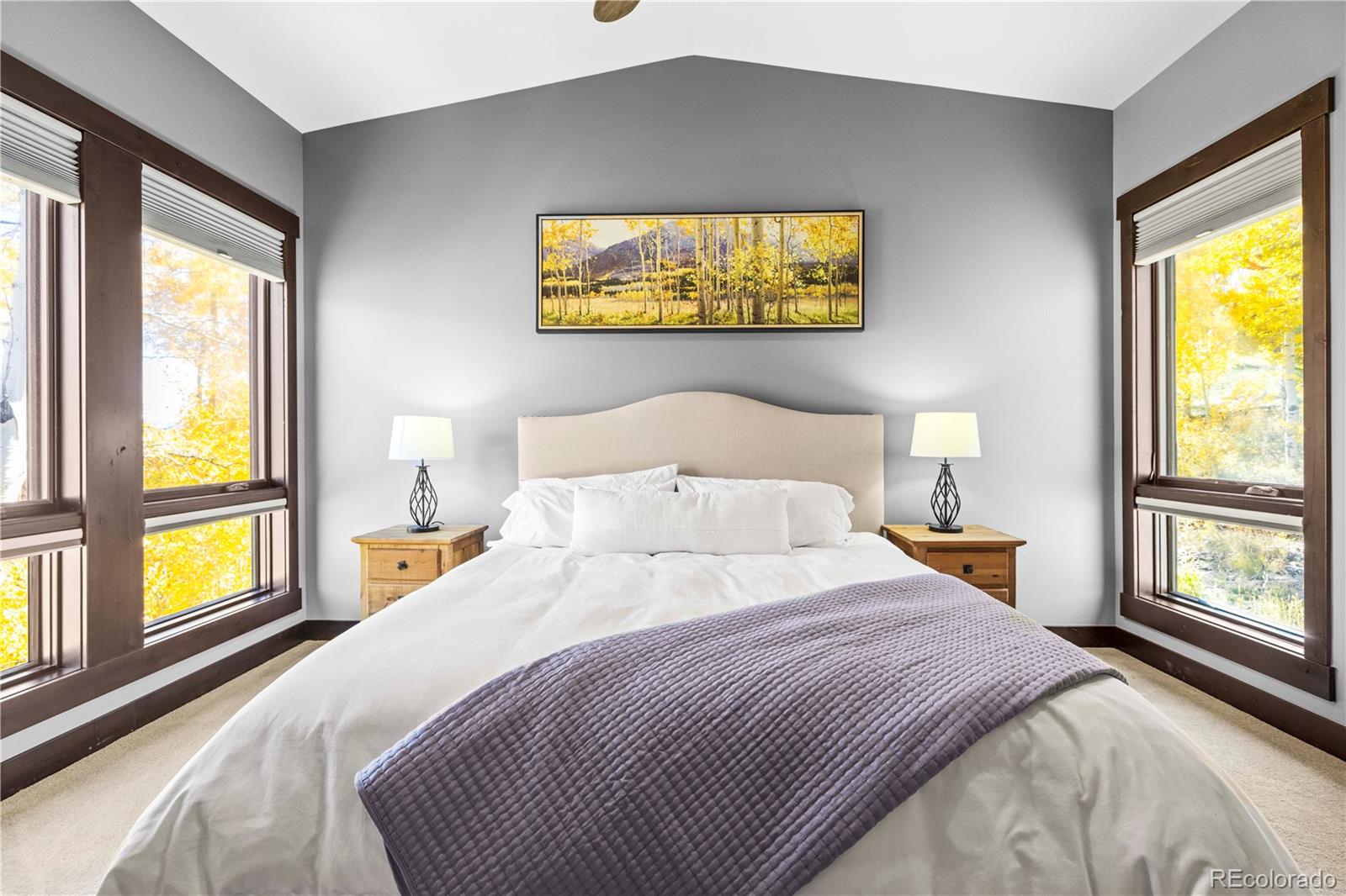 143 Beasley Road Silverthorne, CO 80498 - Photo 16 of 40 a bedroom with a bed and a large window