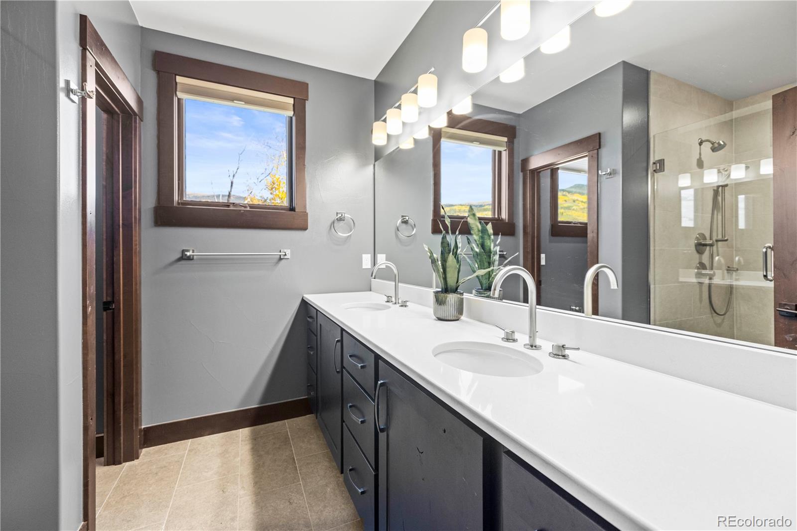 143 Beasley Road Silverthorne, CO 80498 - Photo 18 of 40 a bathroom with a double vanity sink mirror and