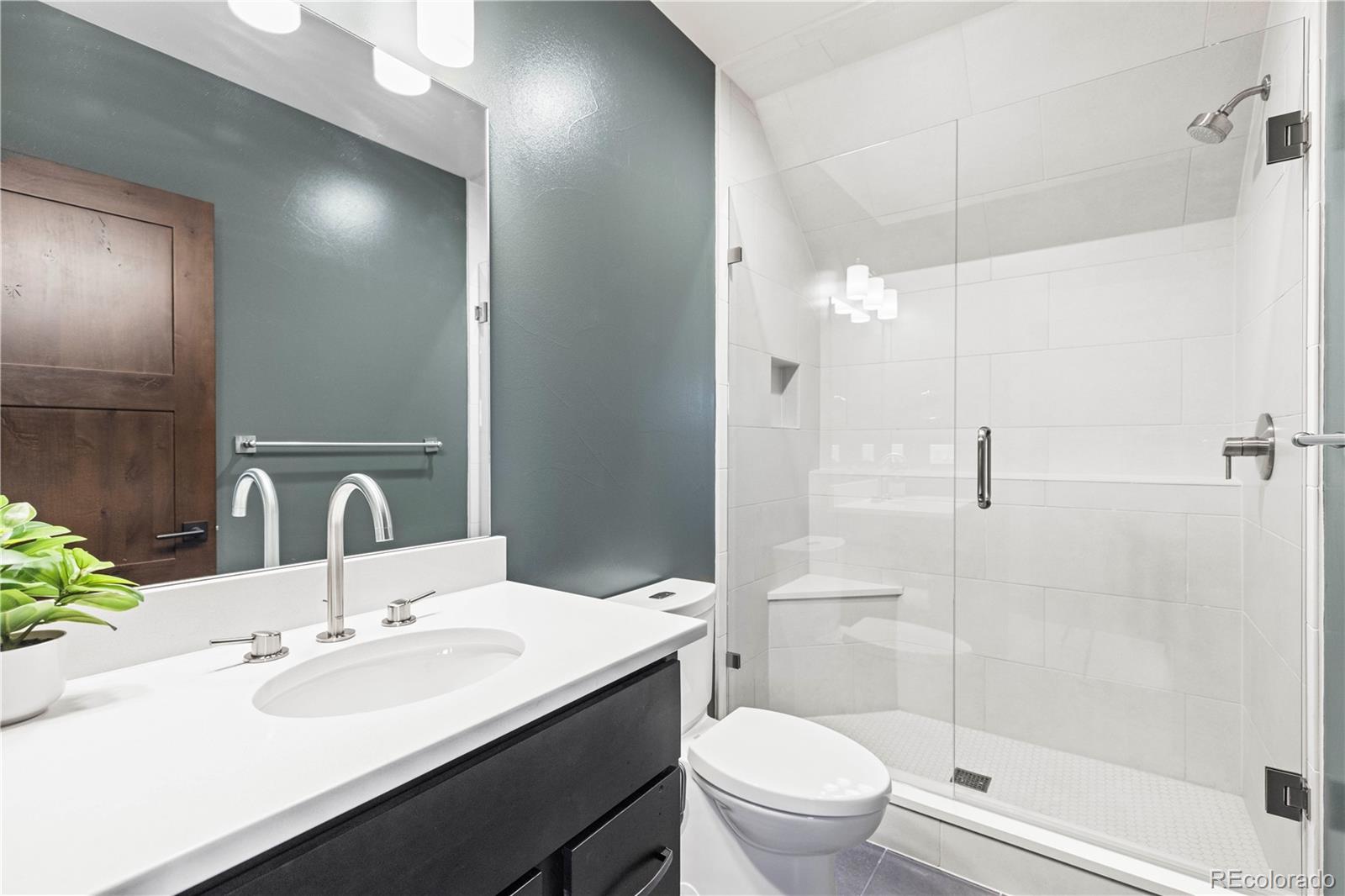 143 Beasley Road Silverthorne, CO 80498 - Photo 24 of 40 a bathroom with a sink a toilet and shower